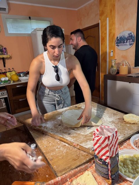 Lior rolling fresh pasta dough in a home kitchen
